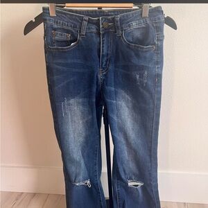 distressed dark blue jeans